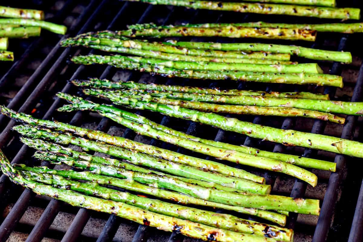showing how to gill asparagus on a grill over medium-high heat