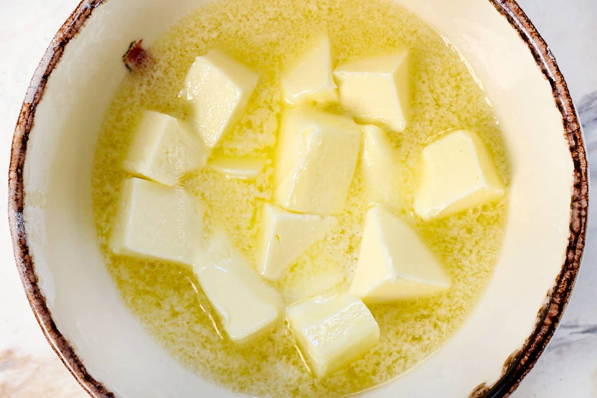 showing how to make edible cookie dough by microwaving the butter in a small bowl until partially melted