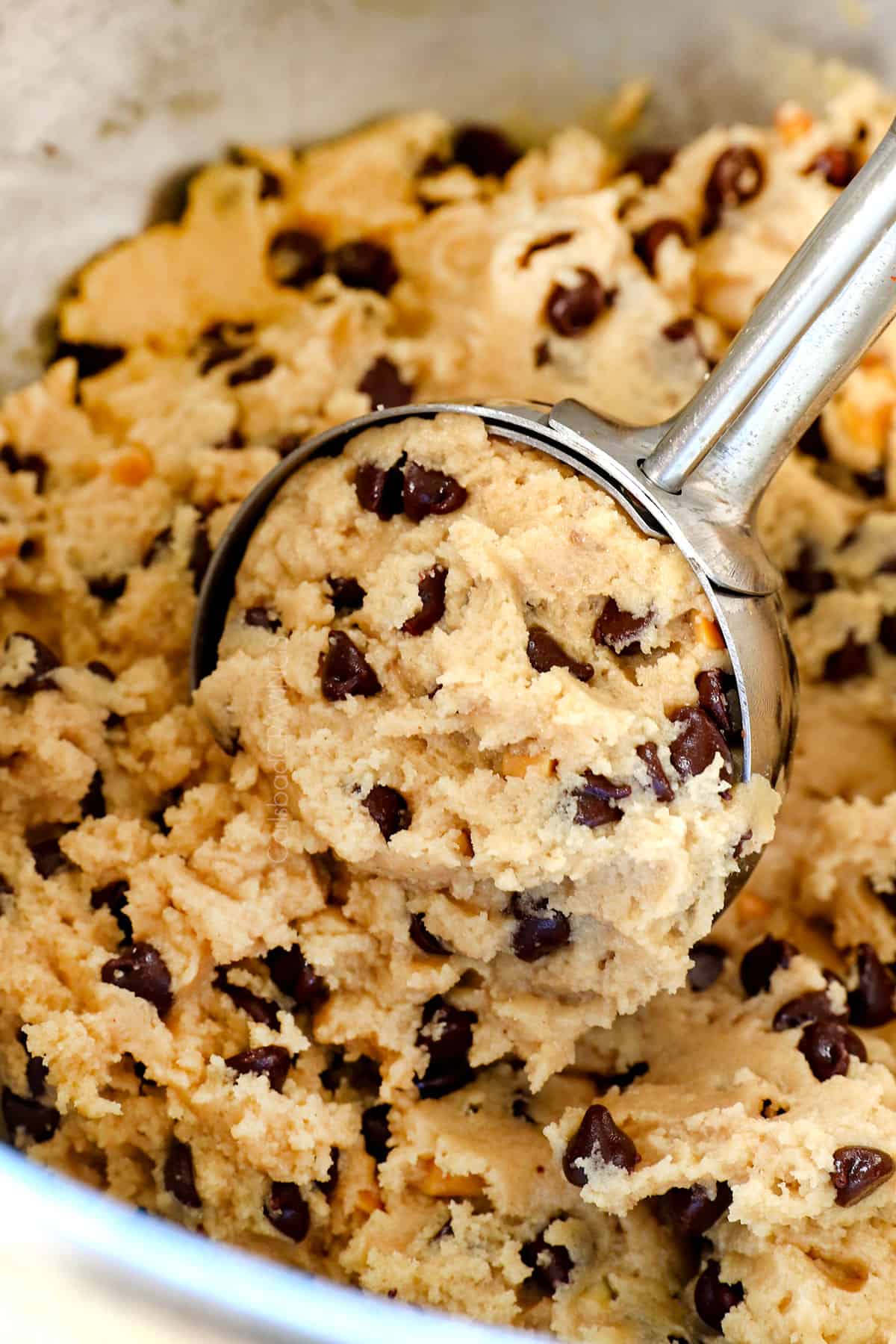 showing how to make edible cookie dough by scooping into balls with a cookie scoop