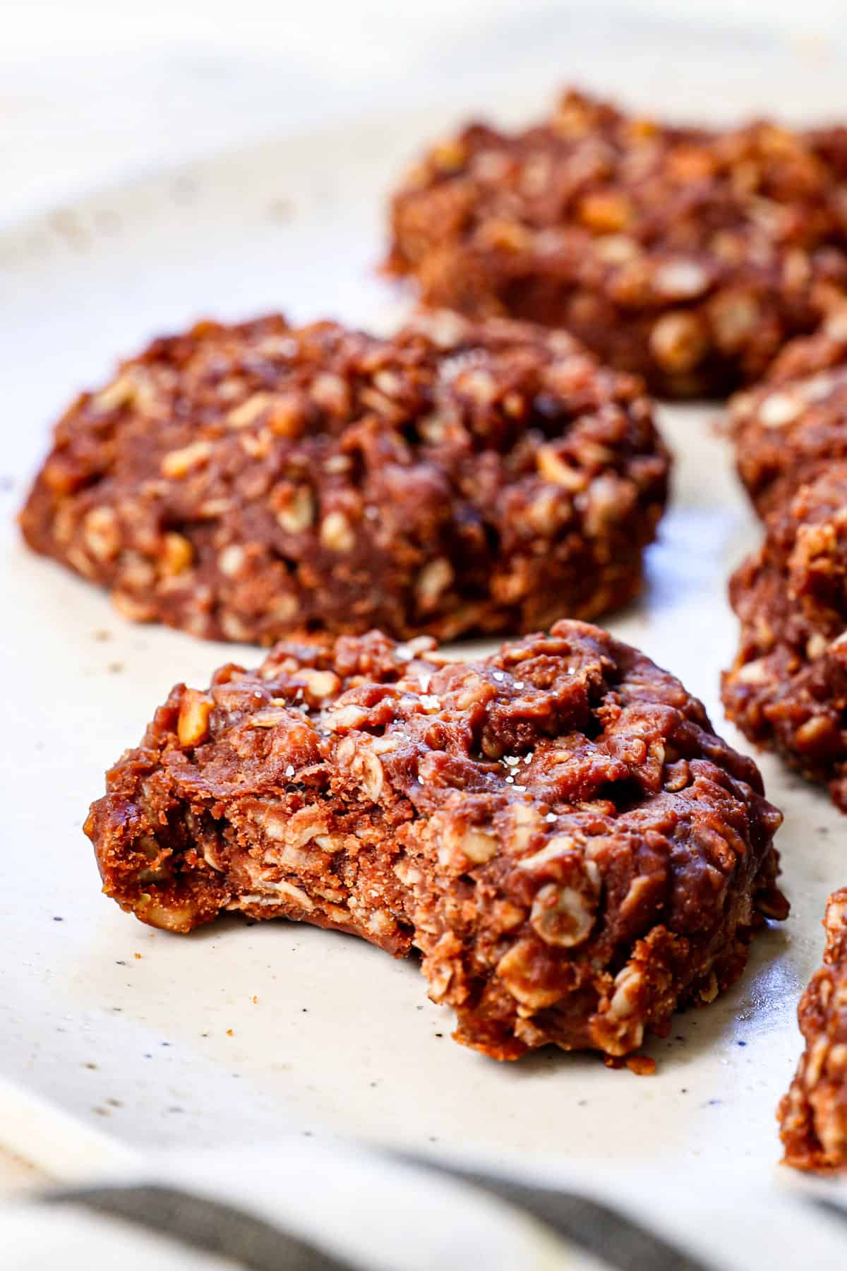 up close of a bite taken out of no bake cookie recipe showing how chewy they are