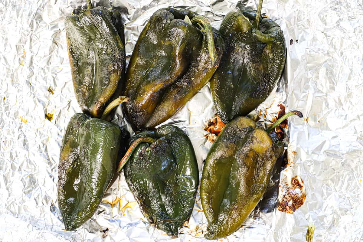 showing how to make chile rellenos by showing what the peppers look like after peeling
