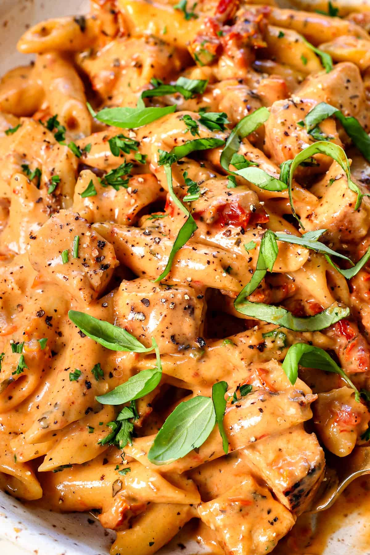 up close of taking a bite of marry me chicken recipe showing how creamy it is