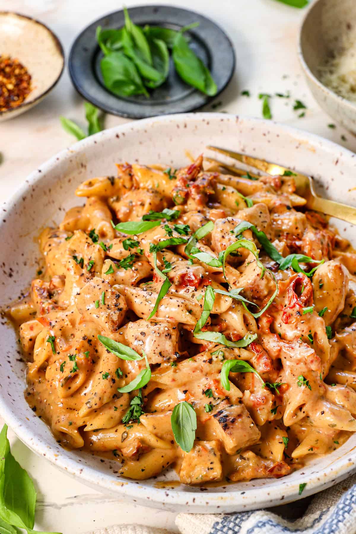 marry me chicken pasta recipe in a bowl garnished with basil
