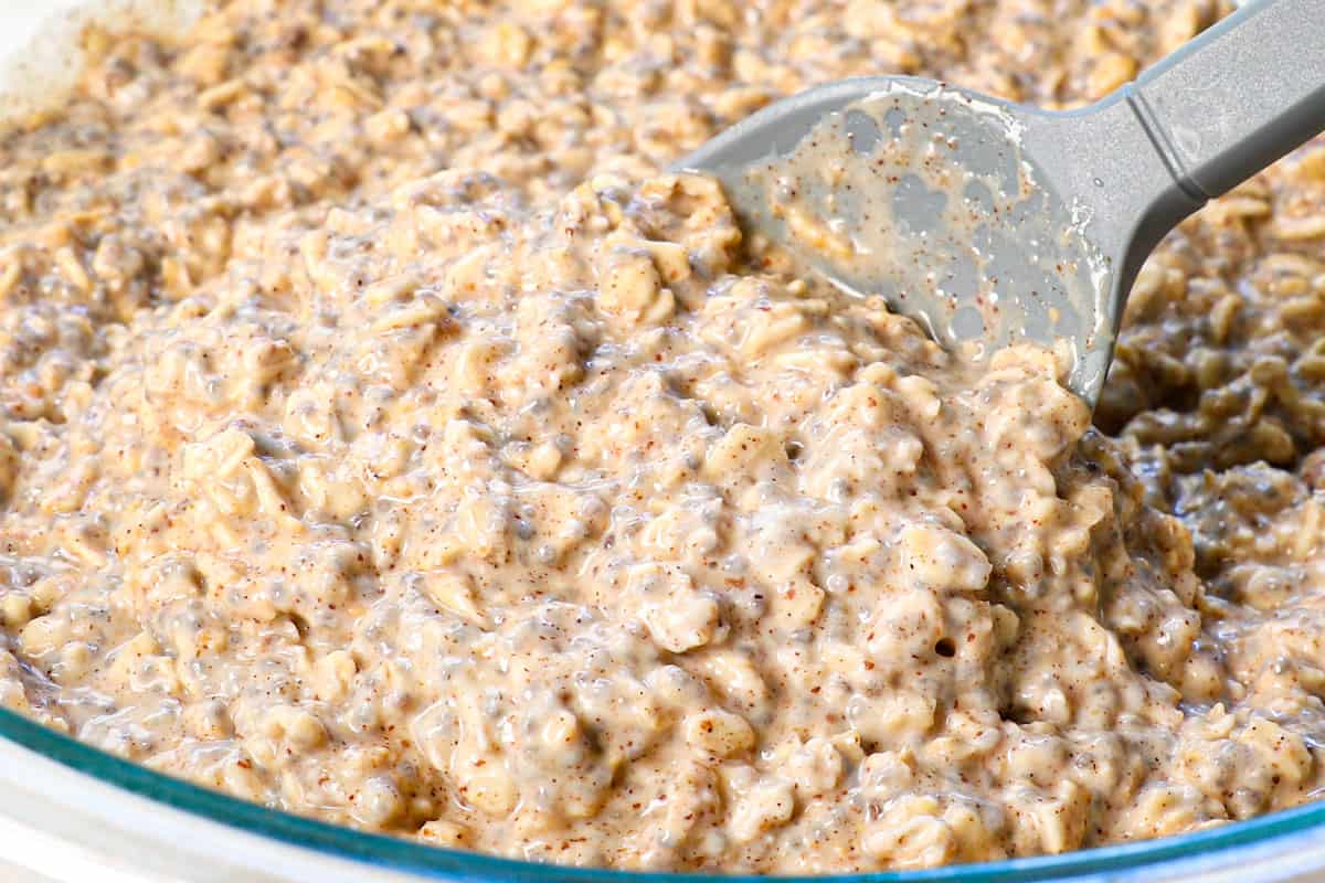 showing how to make overnight oats by adjusting the consistency with added milk