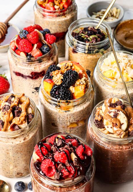 showing how to make overnight oats by diving the mixture into jars and topping nine different ways