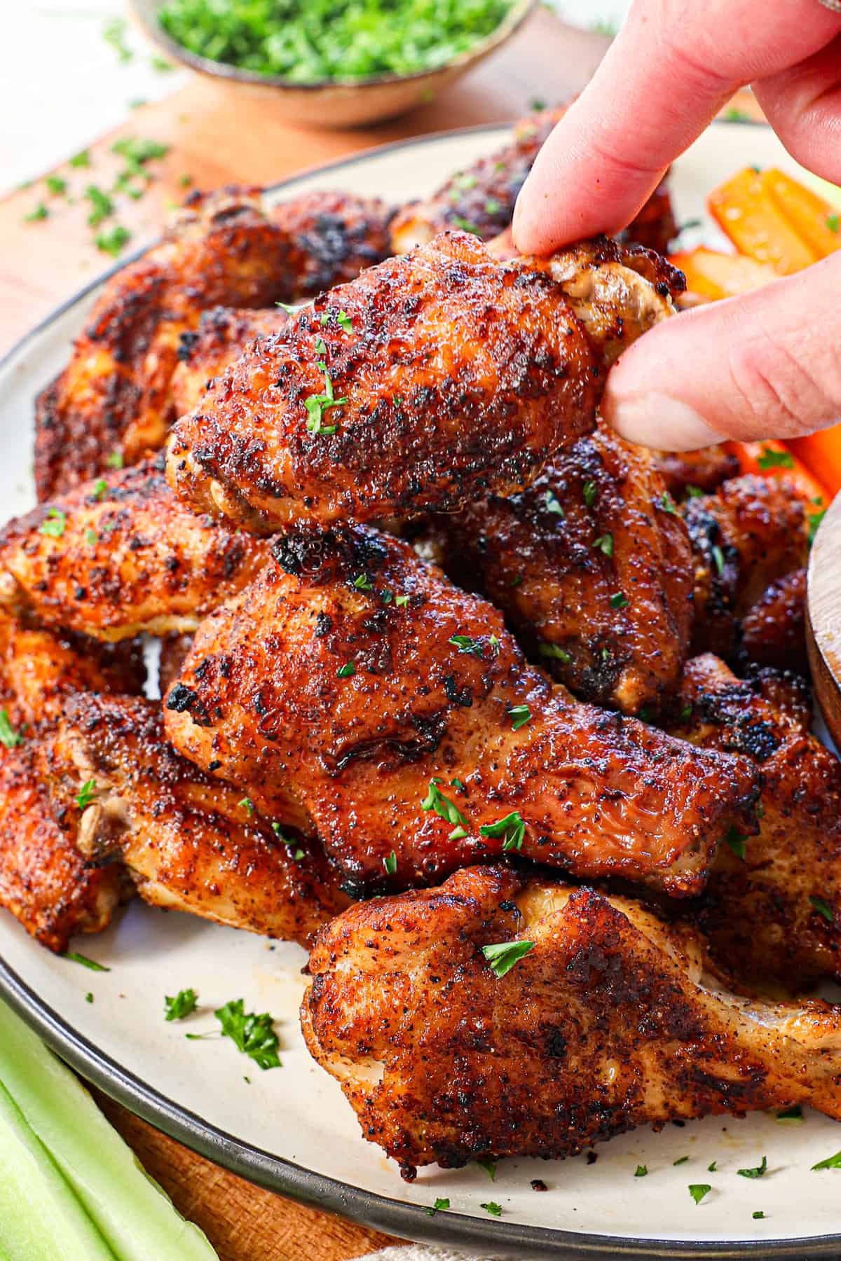 picking up air fried chicken wings