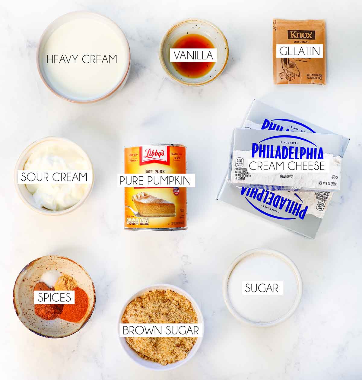 Top view of No Bake Pumpkin Cheesecake Ingredients: pure pumpkin, cream cheese, sugar, spices, gelatin heavy cream