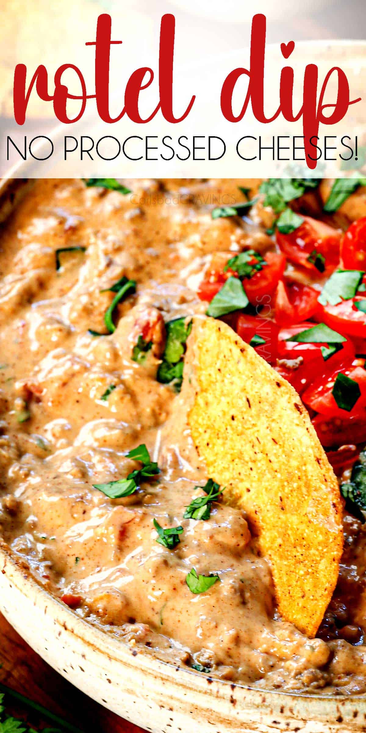 up close of a tortilla chip stuck in a bowl of Rotel Dip showing how creamy it is