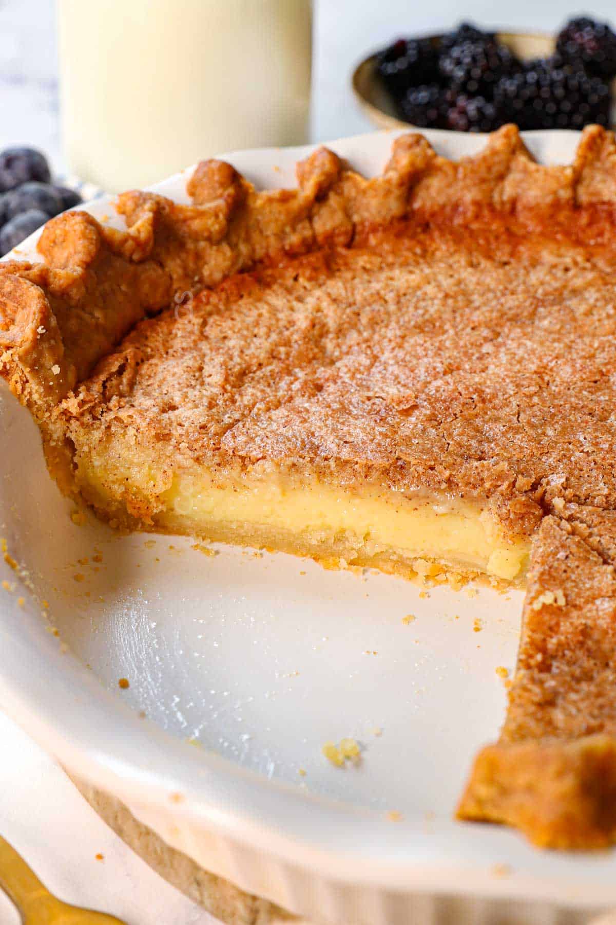 recipe for chess pie with slices removed showing the creamy custard