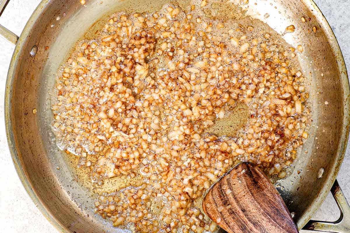 showing how to make creamed corn by sautéing the shallots and garlic in bacon grease