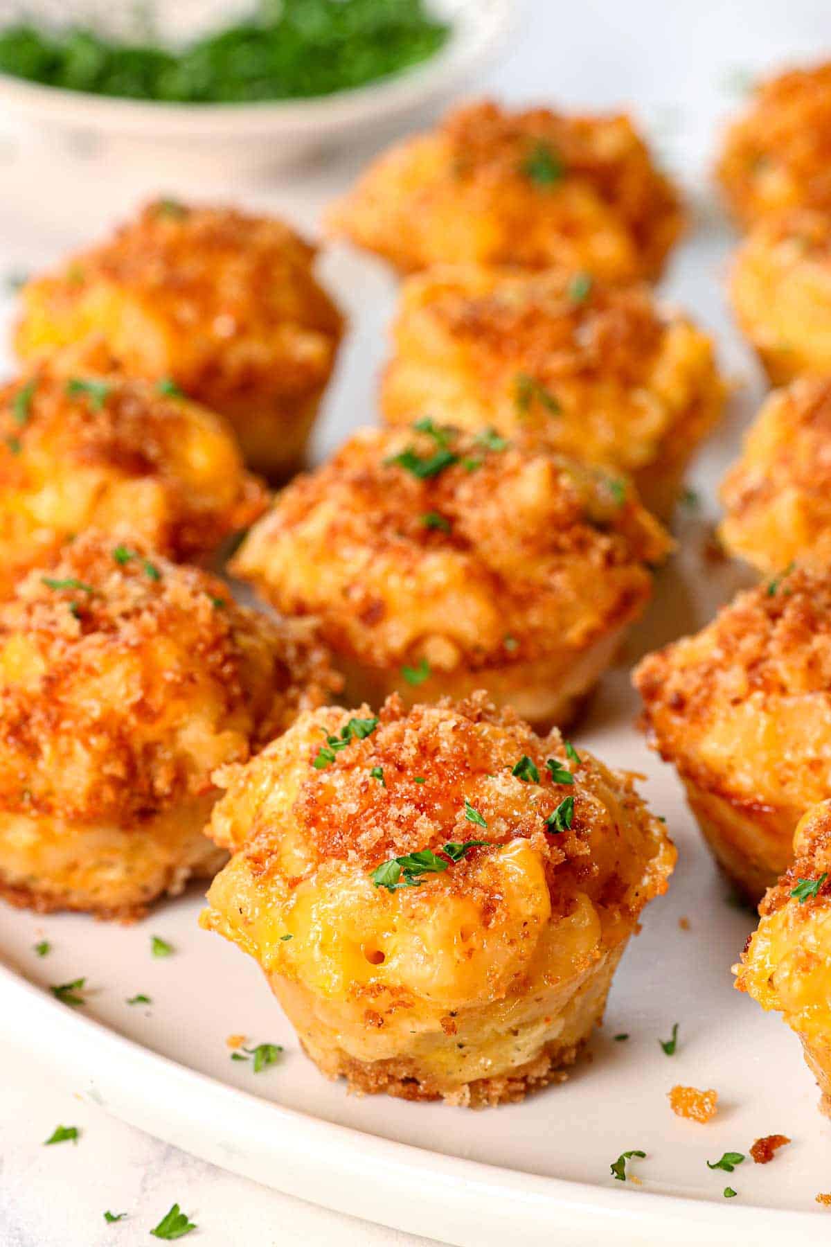 up close of mac and cheese bites recipe garnished with parsley