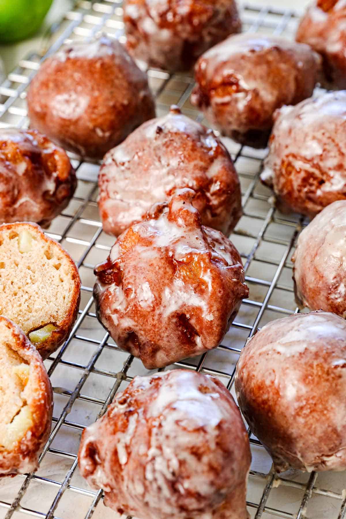 homemade apple fritters on a wire rack
