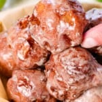 apple fritter recipe stacked on a platter with glaze
