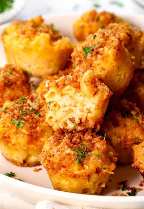 up close of mac and cheese bite in half showing the cheesy inside