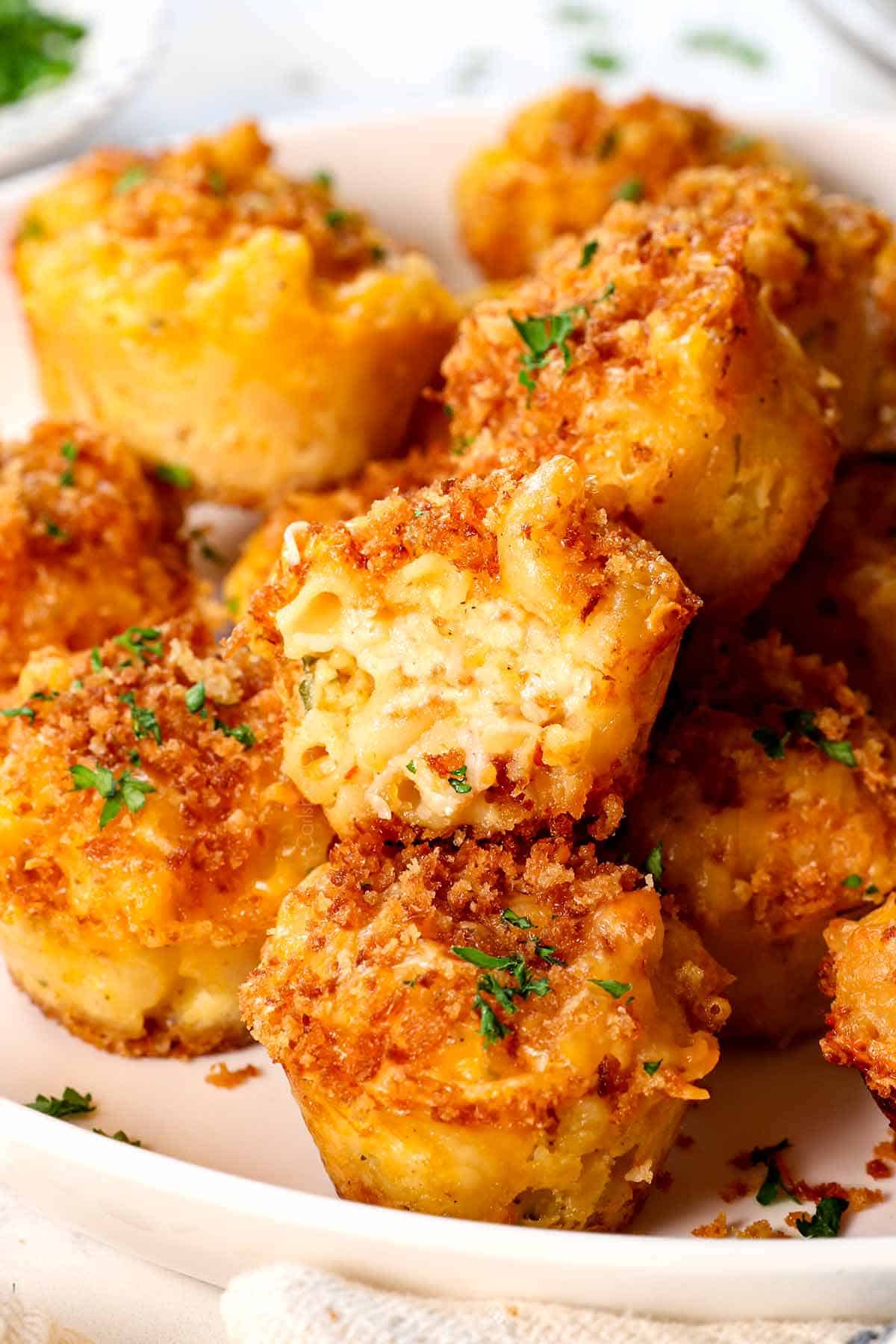 up close of mac and cheese bite in half showing the cheesy inside