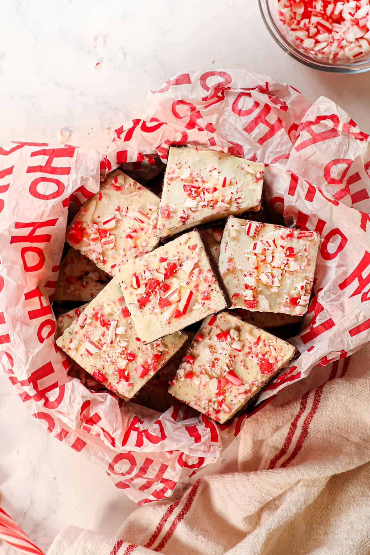 top view of homemade peppermint bark in a tin for gifting