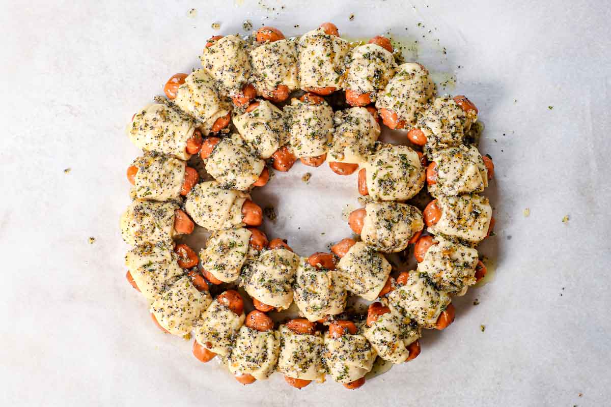 showing how to make pigs in a blanket by baking until golden