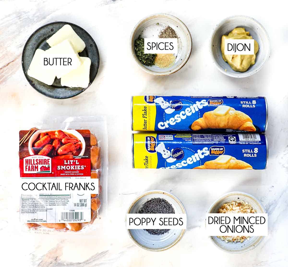 pigs in a blanket recipe ingredients: Pillsbury crescent rolls, little smokies, Dijon mustard, butter, poppy seeds and spices