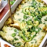 up close of scooping enchilada suzias from the pan to serve