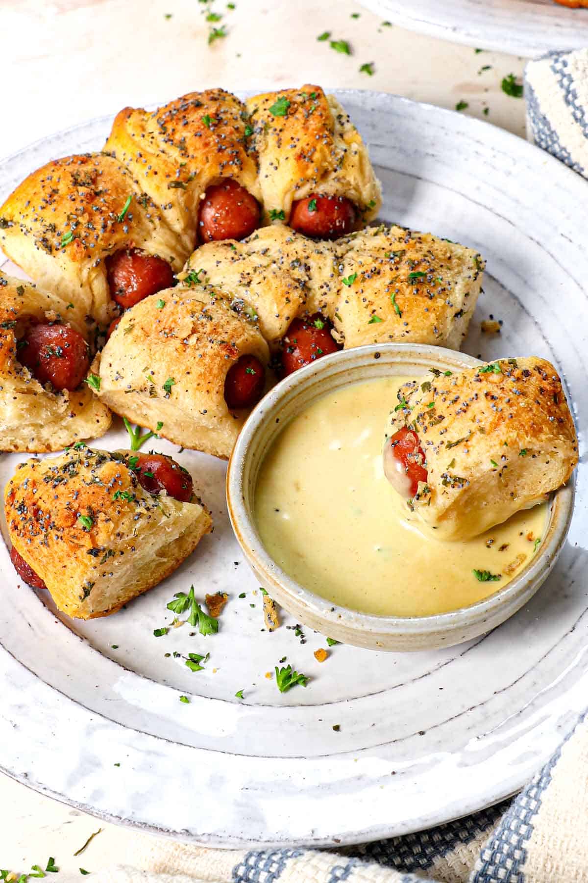 serving pigs in a blanket recipe on individual plates