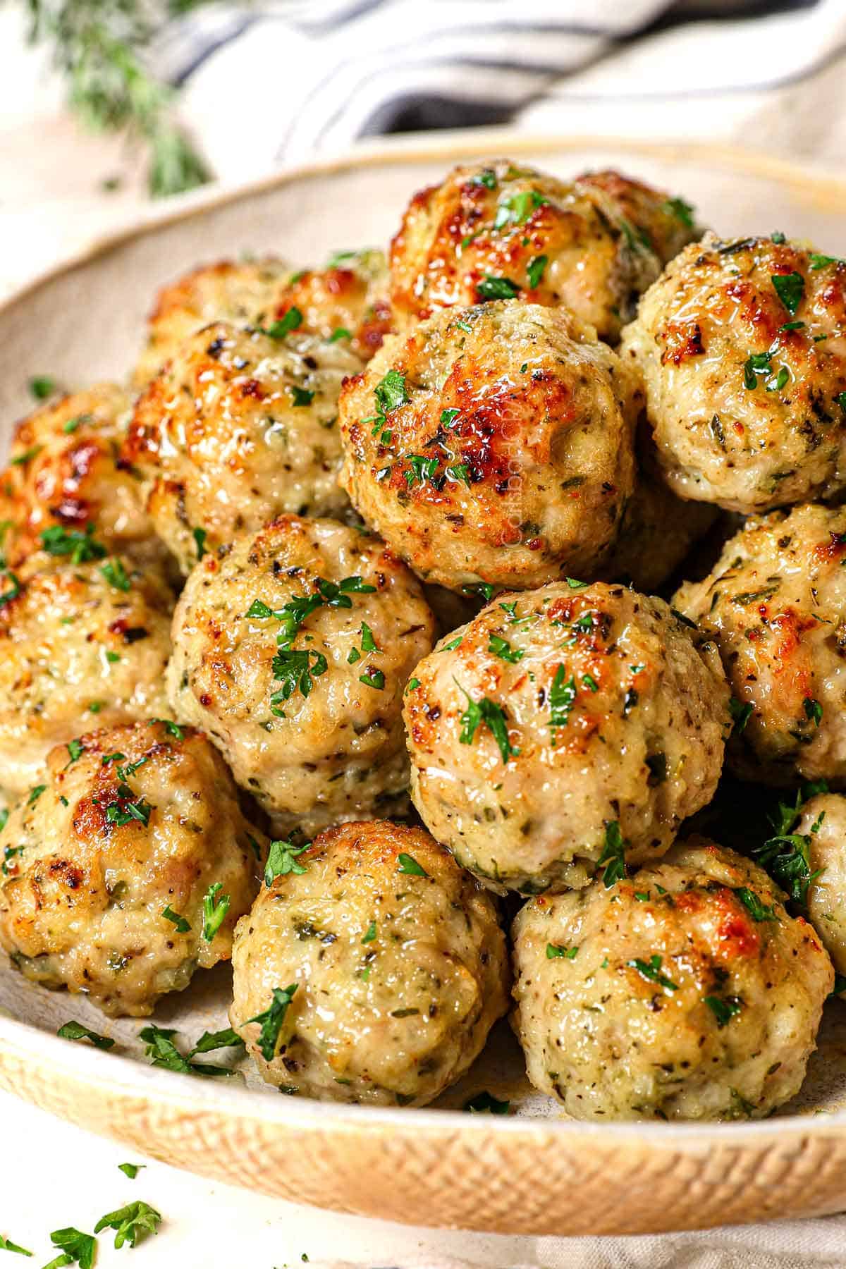 chicken meatballs recipe piled on a plate showing how juicy they are