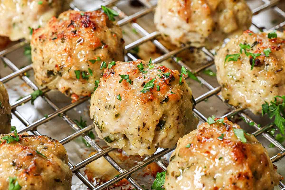 showing how to make chicken meatballs by baking until cooked through