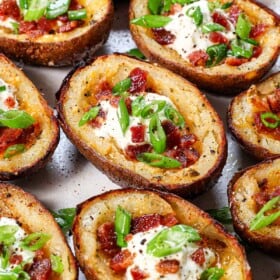up close of homemade potato skins showing the crispy exterior and loaded interior