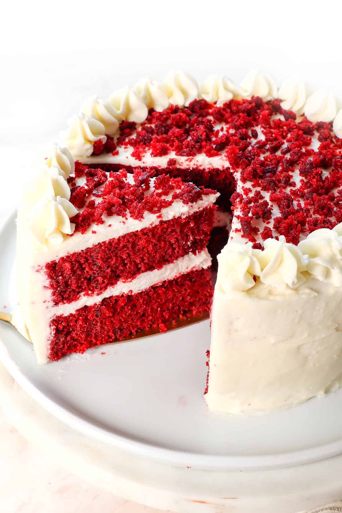 best red velvet cake recipe with a slice cut out