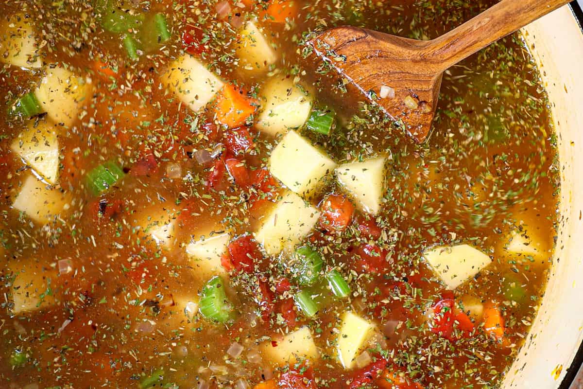 showing how to make vegetable soup by simmering the soup for 15 minutes