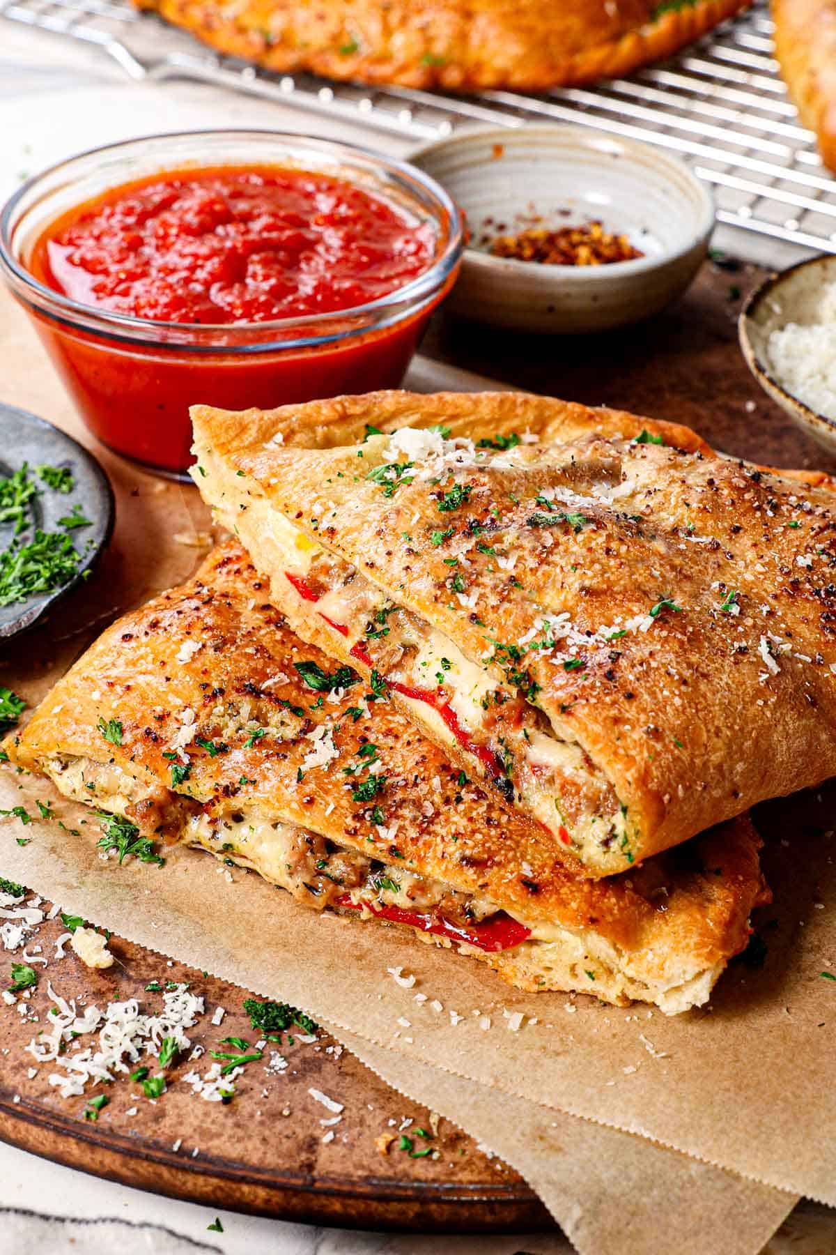 homemade calzones cut in half and stacked to show the inside