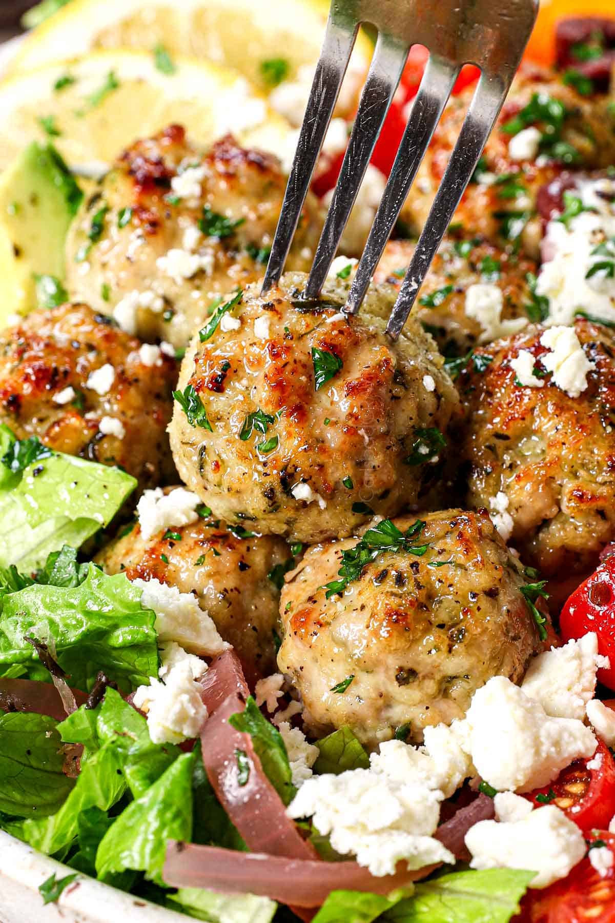 a fork piercing the best chicken meatballs to eat