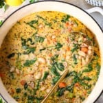 showing how to make white bean soup by garnishing with parsley and Parmesan