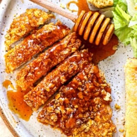 top view of hot honey chicken sliced on a plate showing how to serve