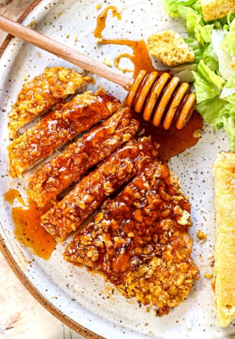 top view of hot honey chicken sliced on a plate showing how to serve