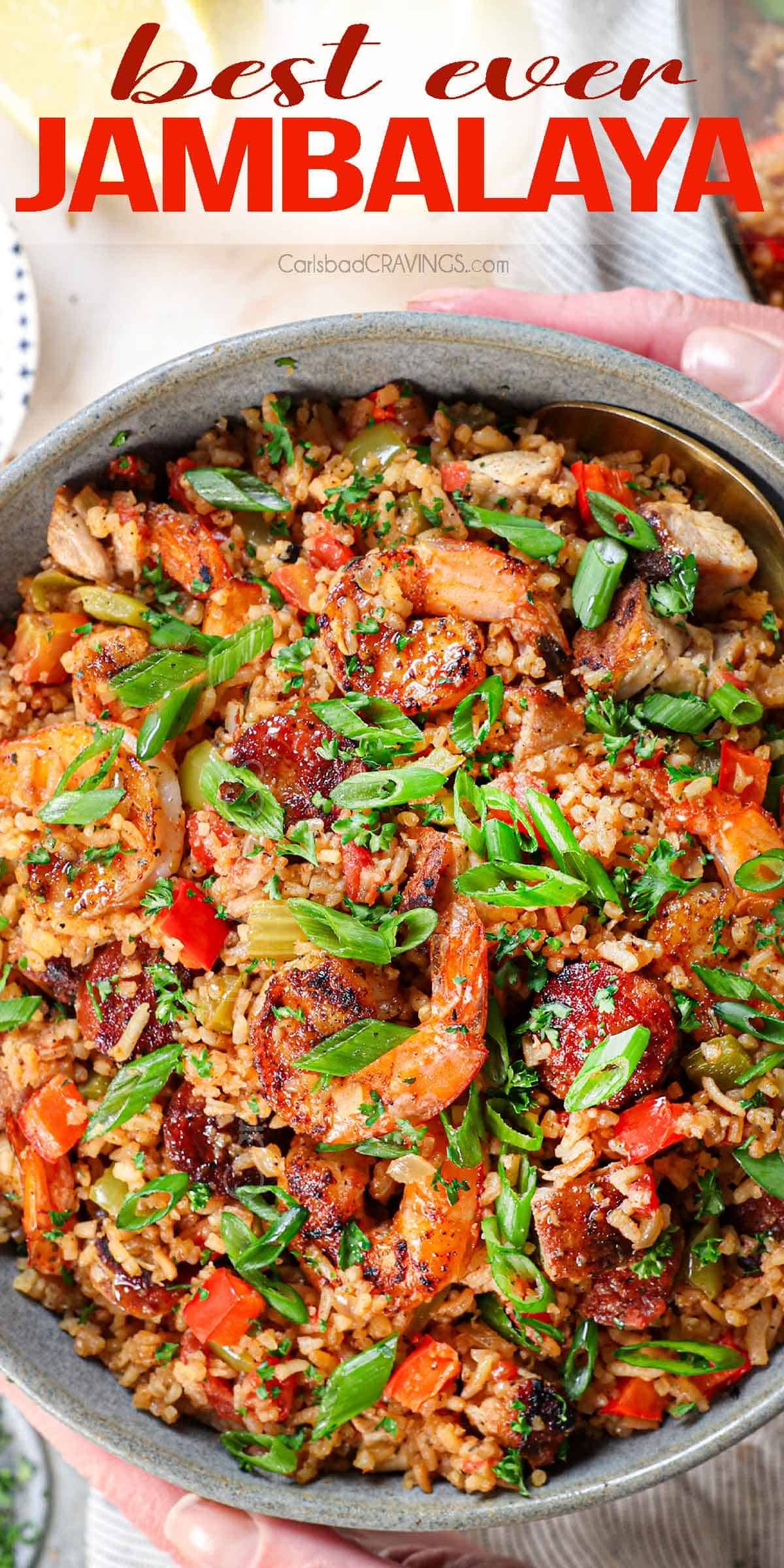 top view of jambalaya in a bowl garnished with green onions and parsley