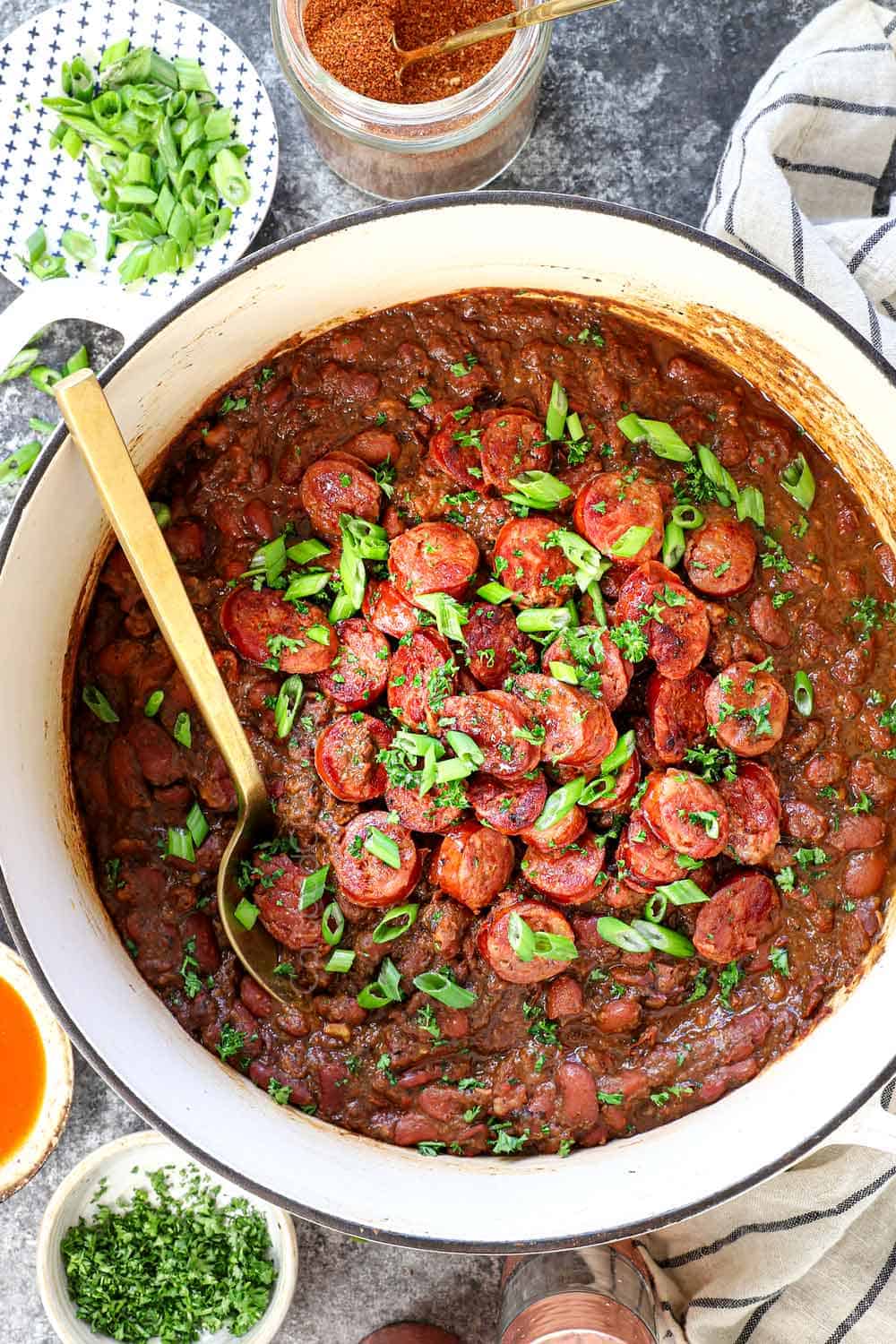 showing how to make red beans and rice by adding the sausage back to the pot