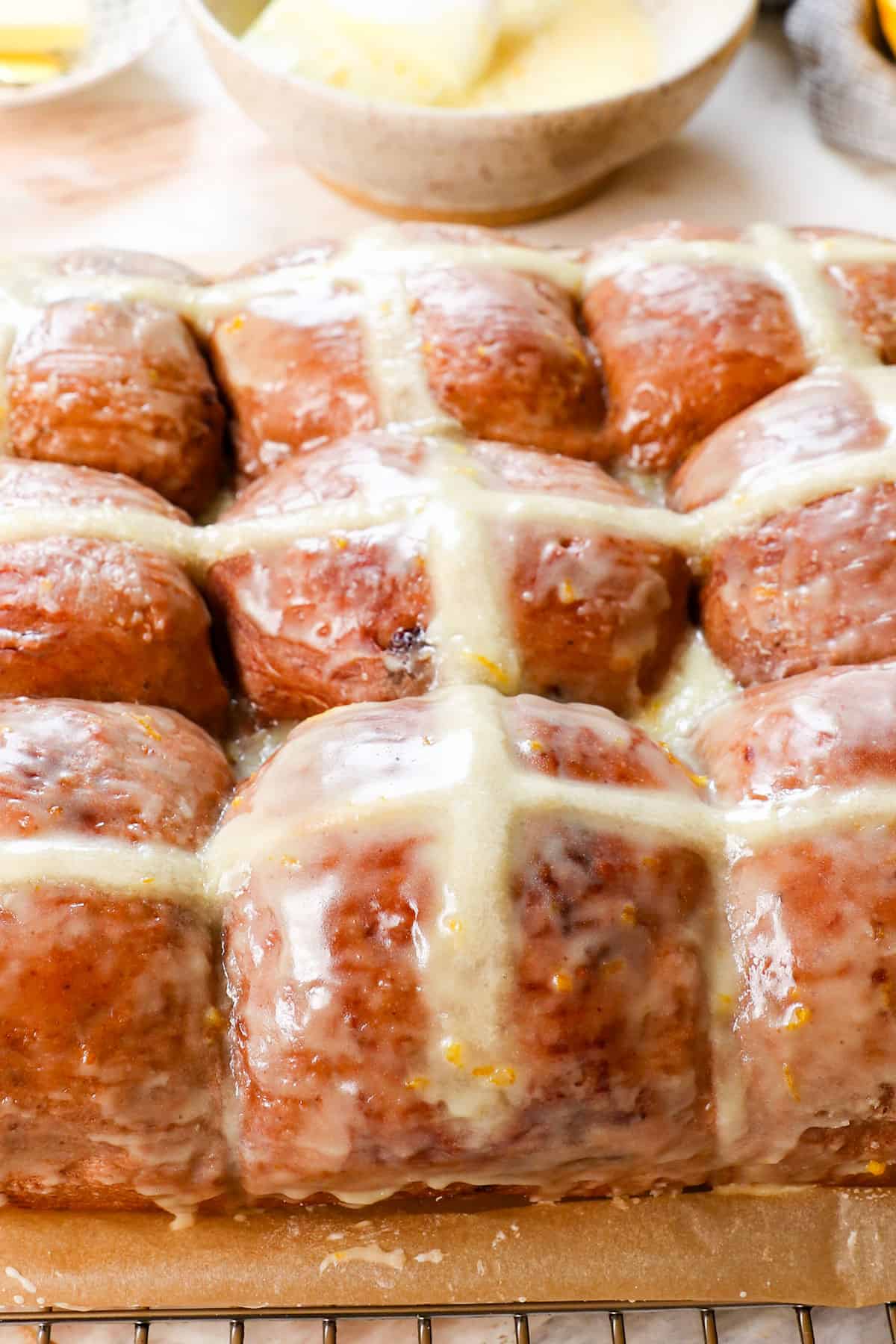hot crossed buns in a row showing the flour cross baked in