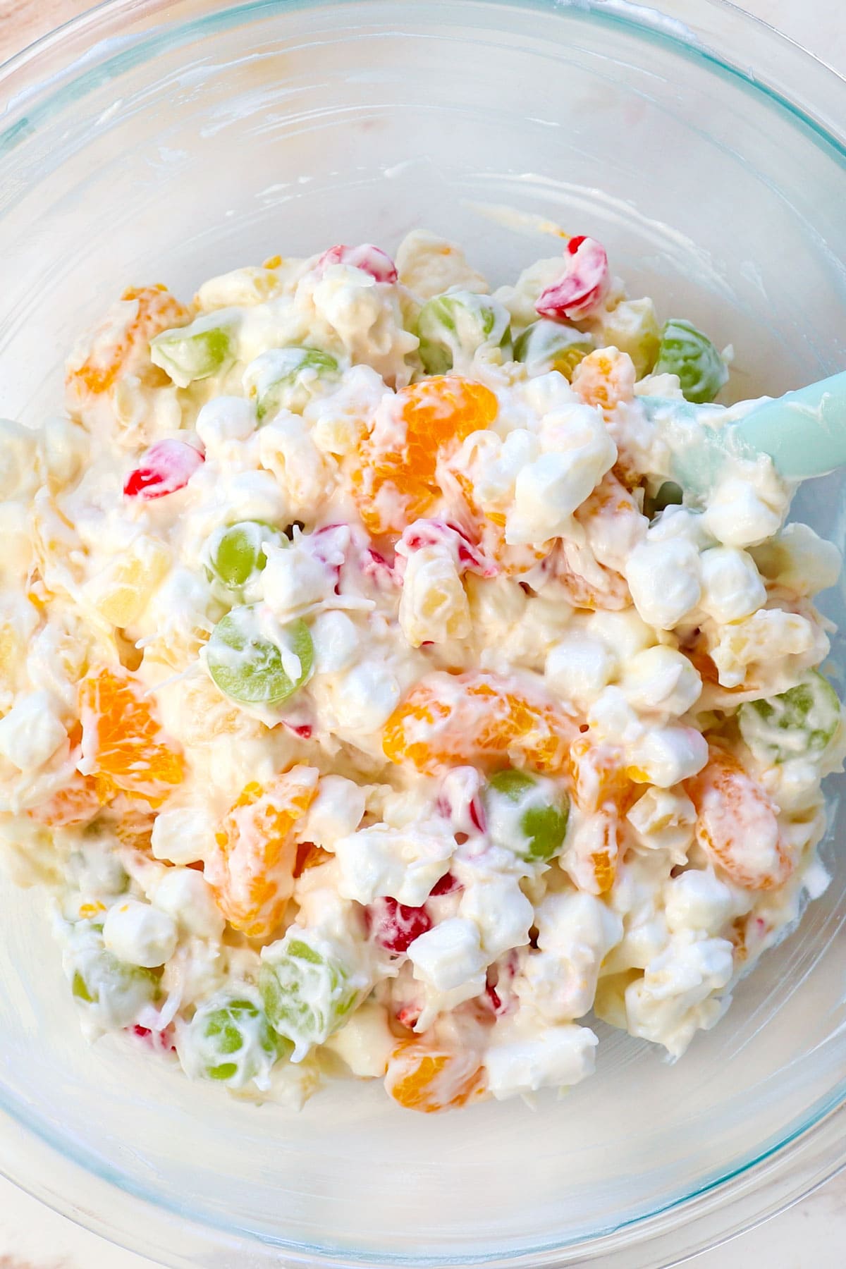 showing how to make ambrosia salad recipe by chilling the ambrosia salad in the fridge