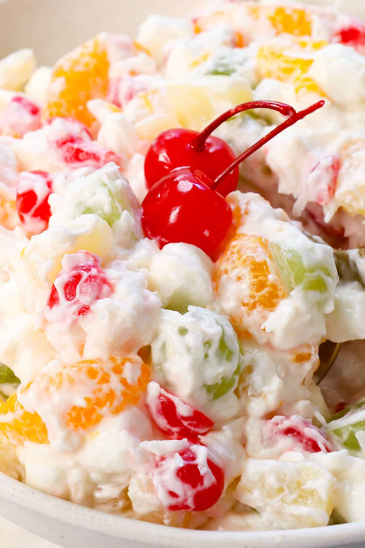 up close of easy ambrosia salad showing how creamy and fluffy the dressing is