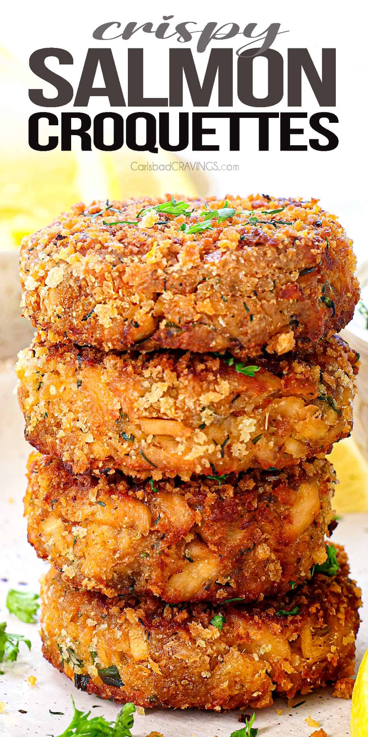 salmon croquettes stacked showing how thick and crispy and golden they are
