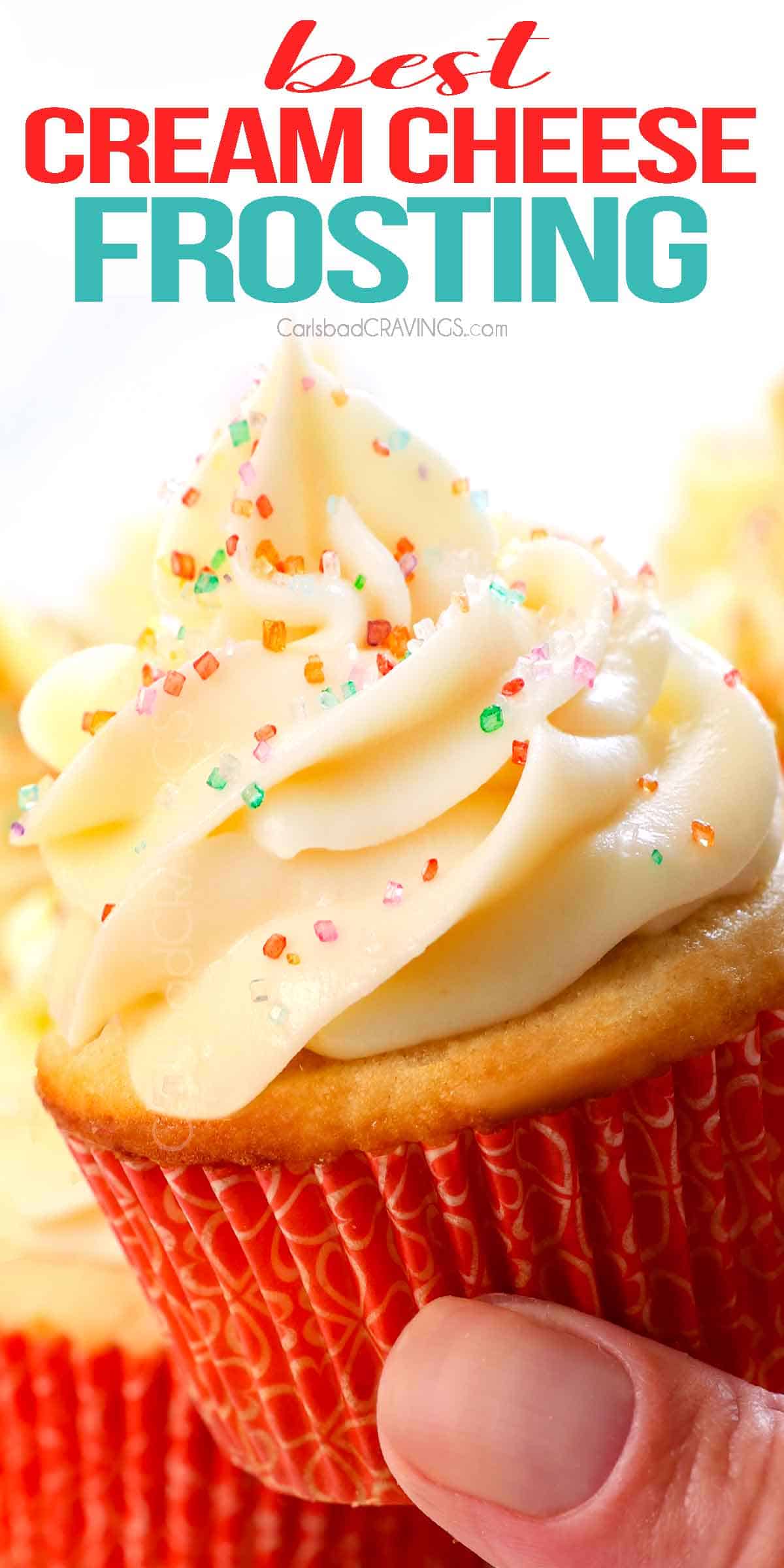 cream cheese frosting on a cupcake showing how tall and fluffy it is