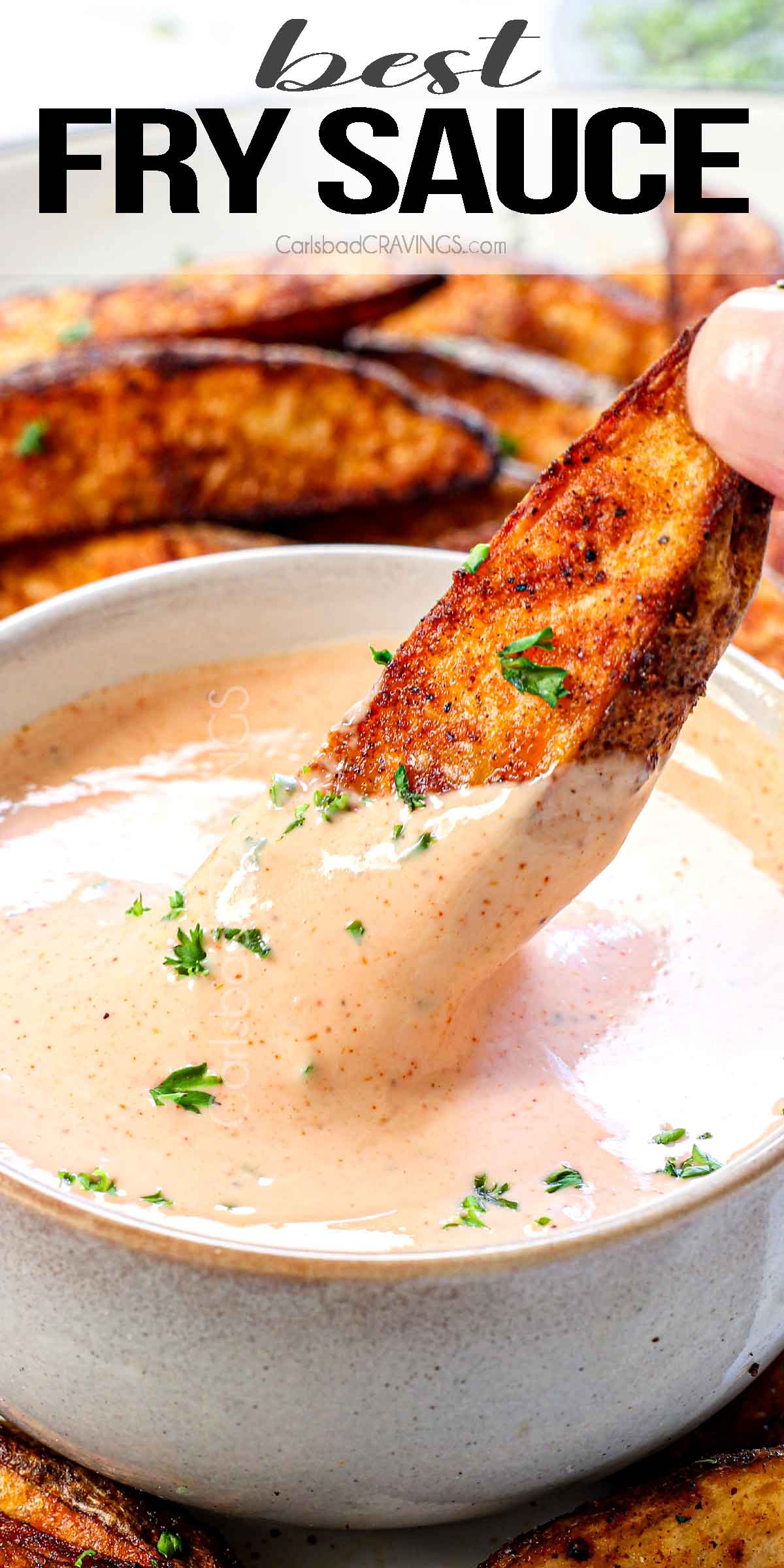 up close of dipping French fry in fry sauce showing how creamy it is
