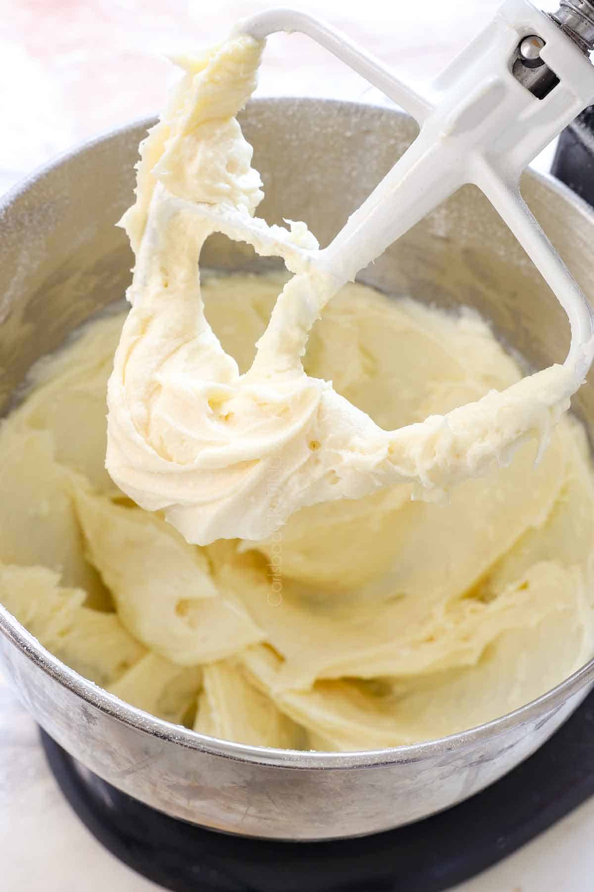 showing how to make cream cheese frosting by beating in a blender until smooth
