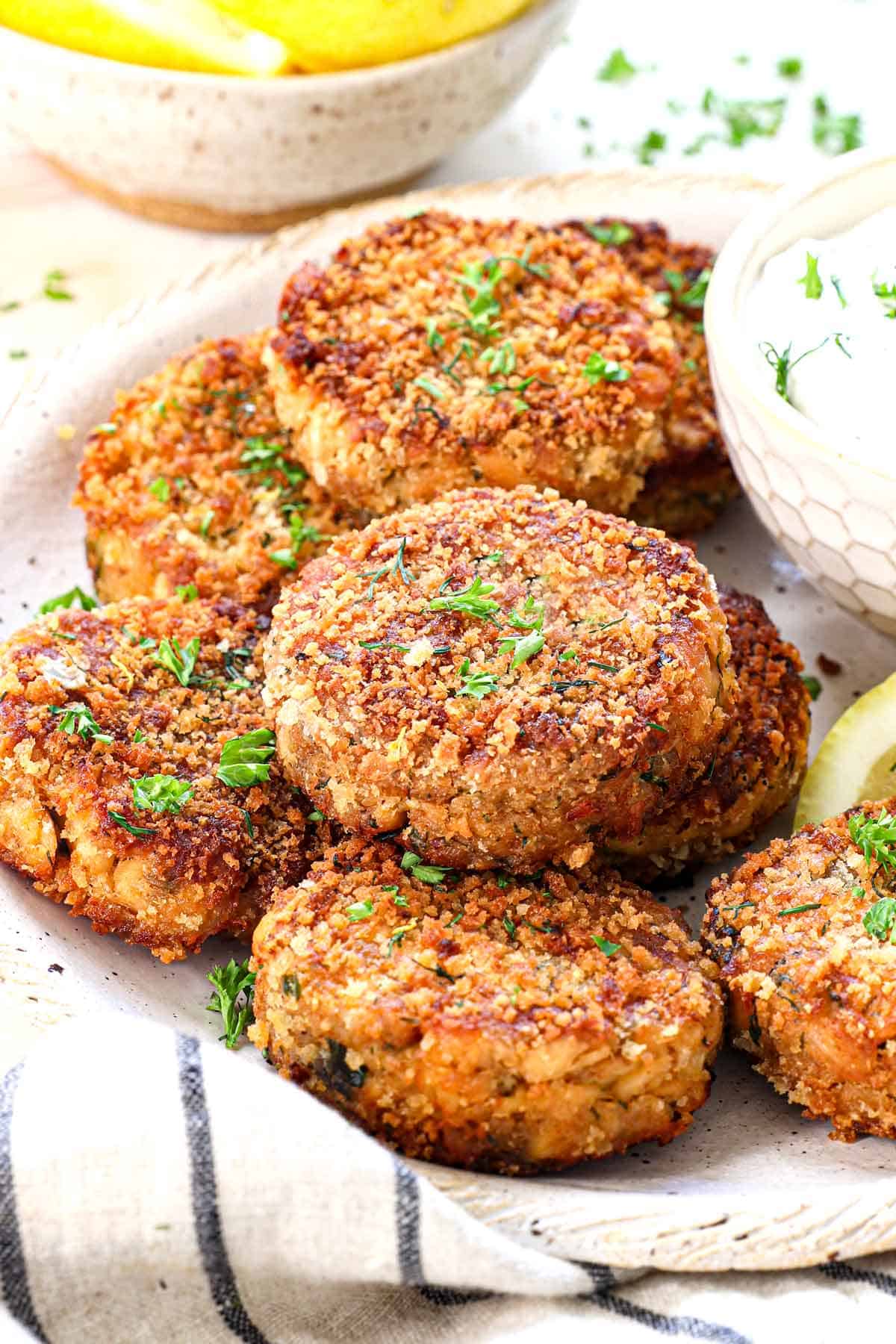 salmon croquettes recipe being served on a plate garnished with parsley